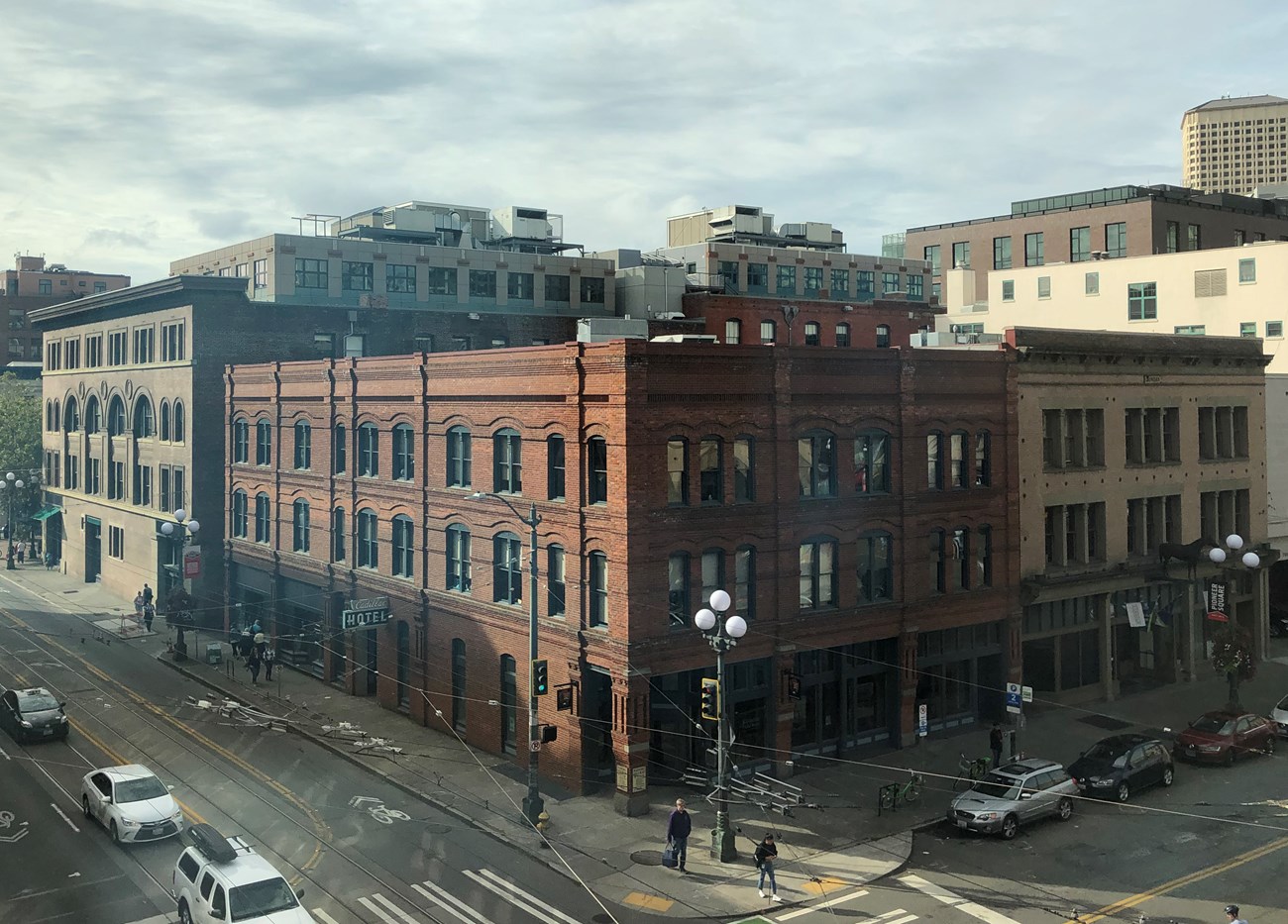 a large brick building on a busy street corner