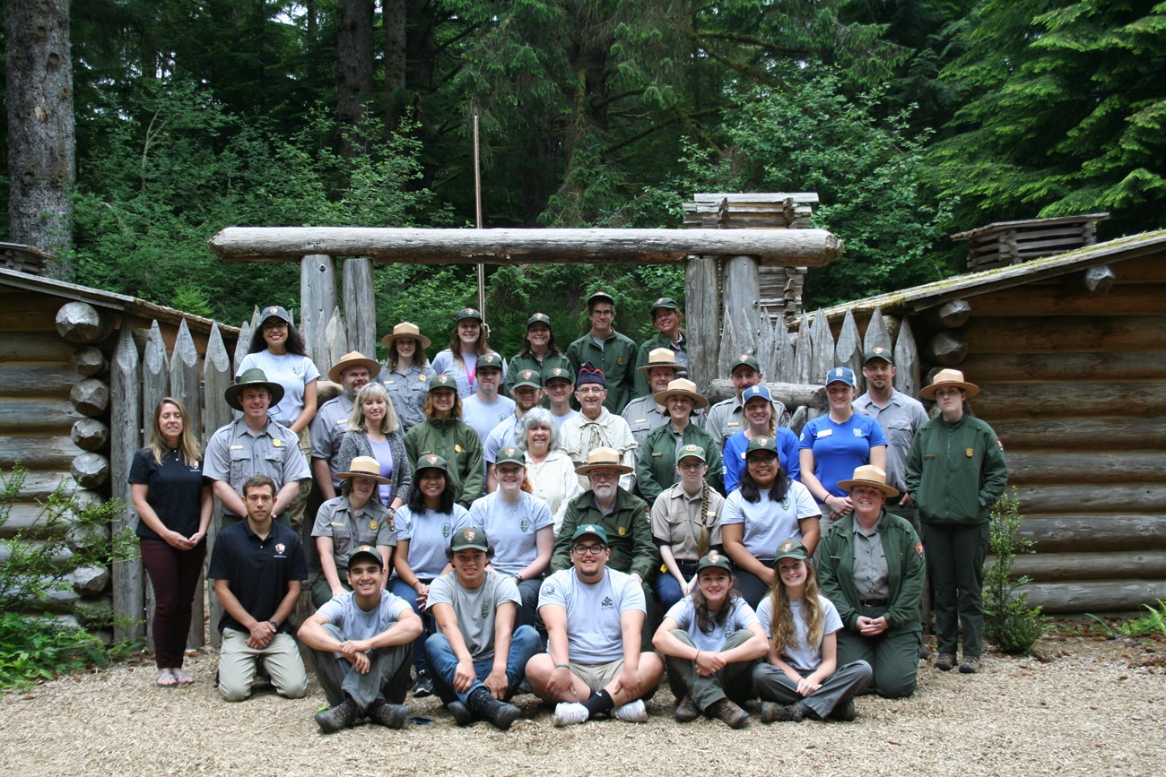 Staff, Interns, and volunteers standing in front of Fort Clatsop