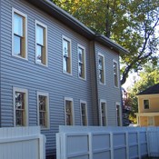 A long 2 story gray-brown house