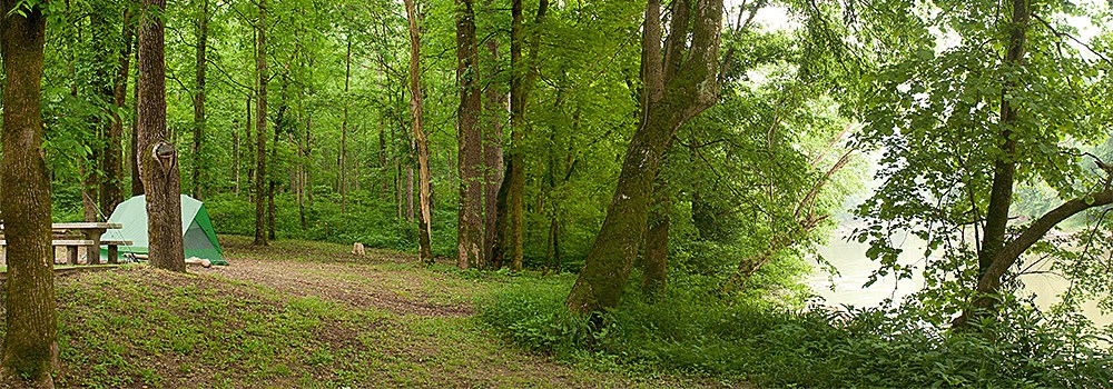 A tent by the Green River at Houchin Ferry Campground