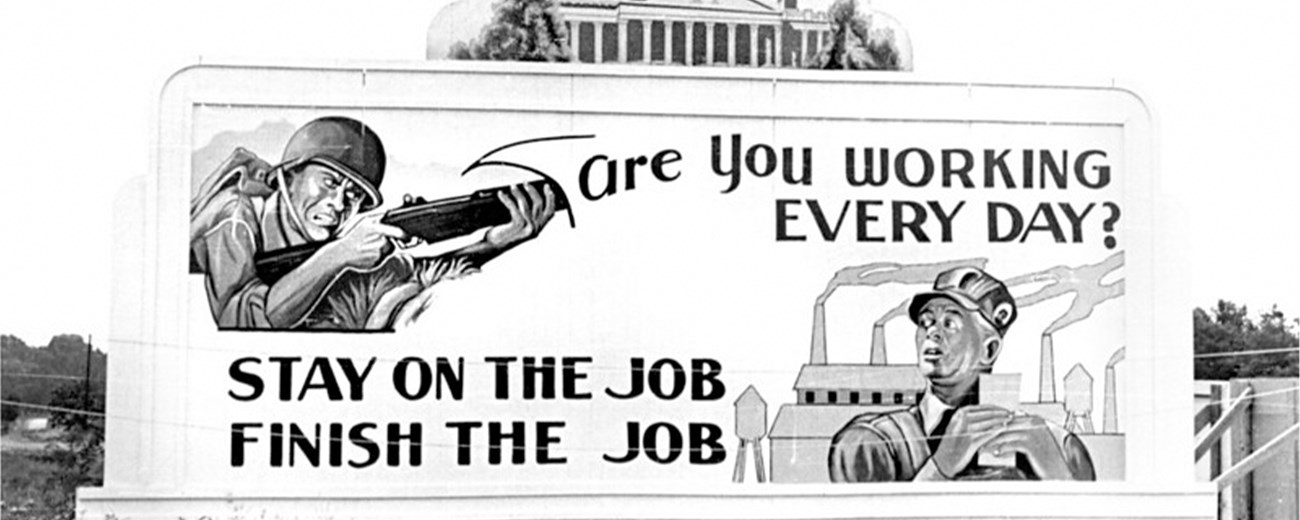 A billboard in Oak Ridge reads "Are you working everyday? Stay on the job. Finish the job."