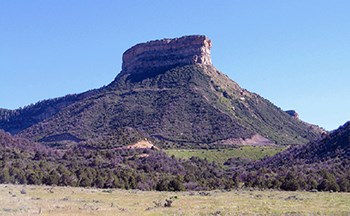 Green, flat-topped mesa