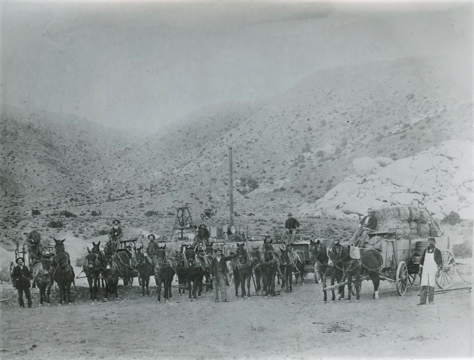 Chester Pinkham and unidentified man at camp