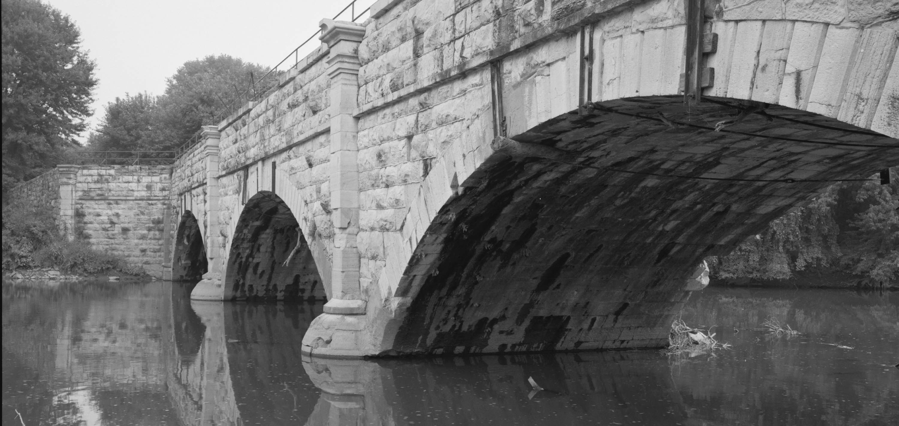 Concrete bridge surrounded by water