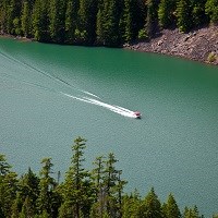 A boat on a green lake.