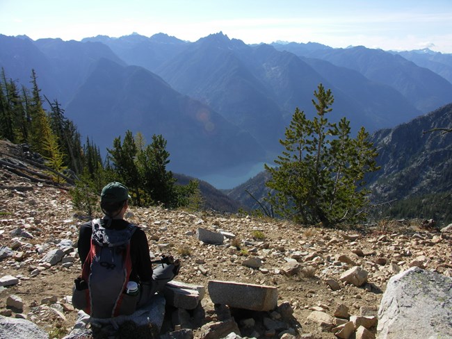 Hiker at Purple Pass overlooking Lake Chelan