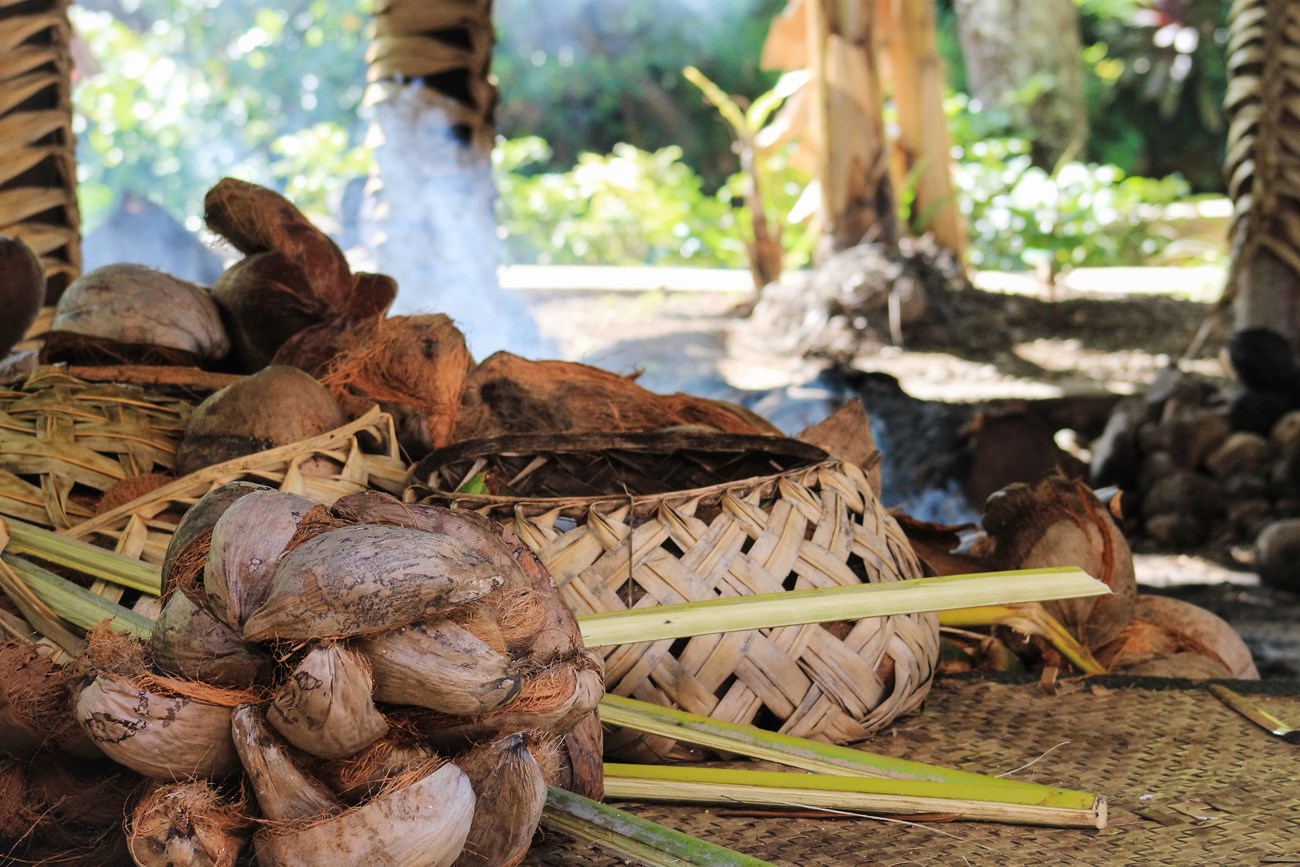 Baskets in a traditional hut used for cooking.