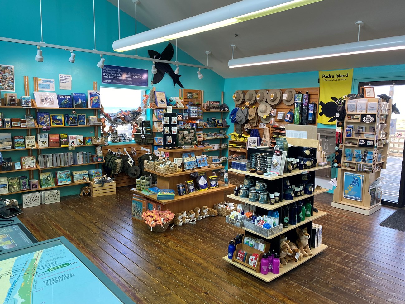 A small gift shop with shelves full of items.