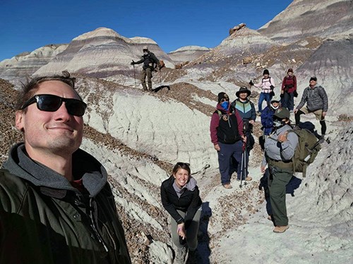 Blue Forest Hike, hikers on a banded badland