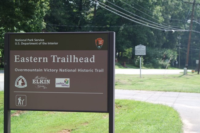 NPS sign for the Eastern Trailhead of the Overmountain Victory National Historic Trail at Elkin