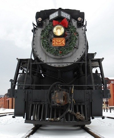 STEA_HolidayExpress2 Steam train with a holiday wreath hanging on it