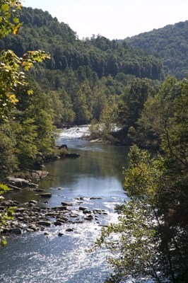 the river is brightly lit by the sun