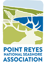 A logo featuring a silhouette of a bull elk's head against a cartoon of coastal grasslands with a semi-circular section of bay on the right. The words Point Reyes National Seashore Association are below the cartoon.