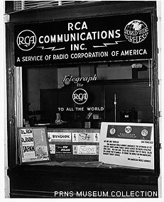 A black and white historic photograph of the storefront of an RCA Communications Incorporated office.
