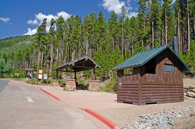 Bierstadt Parking and Vault Toilet - August 2025 The Bierstadt paved parking area, shuttle stop, and new vault toilet are seen in a clear, sunny day in August