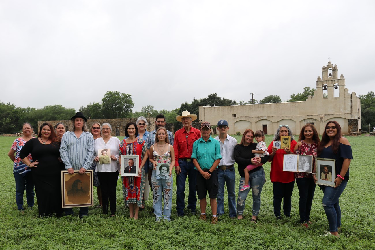 Family gathers with their ancestors at Mission San Juan.