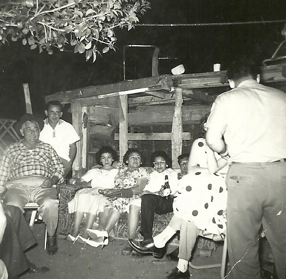 Family sitting outside happy and smiling