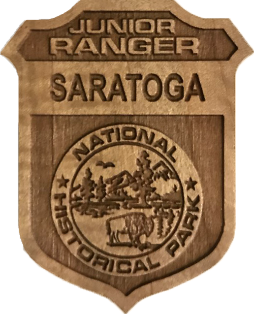 wooden junior ranger badge with saratoga in the top banner