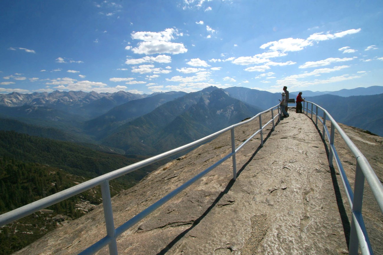 People admire views from within the narrow railing at the top of Moro Rock. Photo courtesy of Paul Johnson.