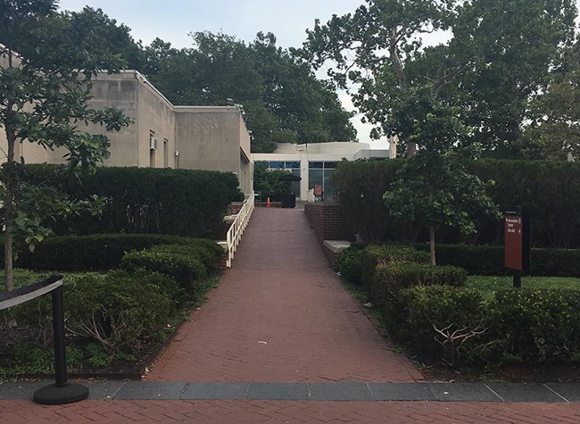 A ramp leading up toward the Dinning patio, cafe/bookstore entrance, and gift shop.