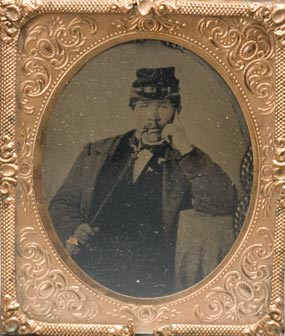 Civil War soldier smoking a pipe.