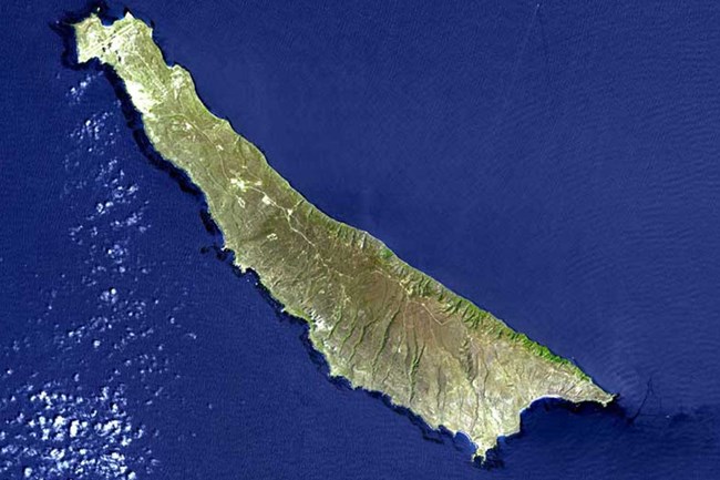 lt= Aerial view of long skinny island.
