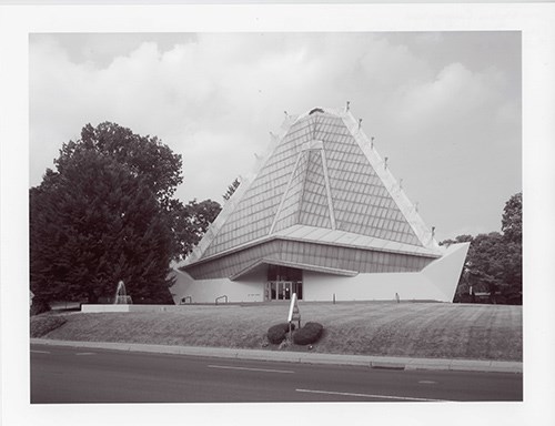 Beth Sholom Synagogue, Elkins Park, Pennsylvania. Ref# 07000430 a glazed, pyramidal tower, broad in form and made up of three sides, and a base of reinforced concrete, steel, and glass
