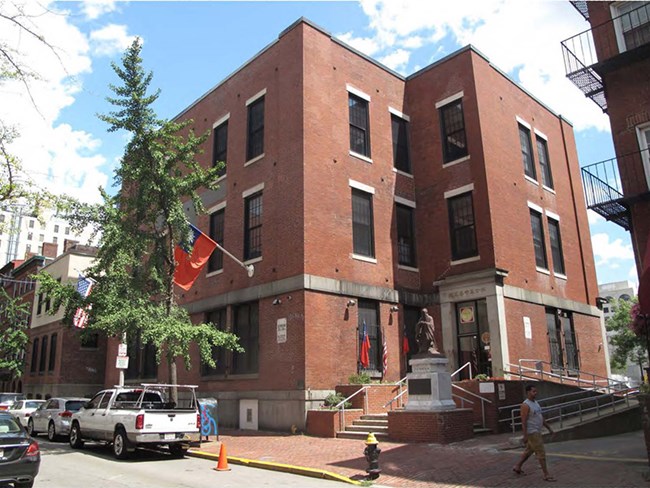 3 story brick building on street corner