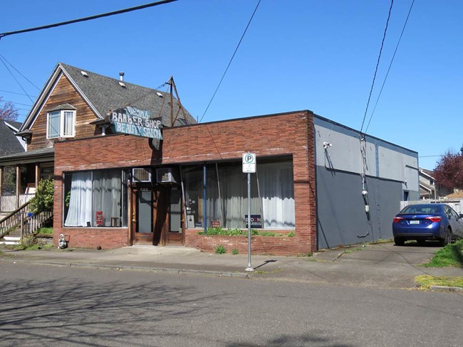 100007455_Deans-Beauty-Salon-Barber-Shop Small single story commercial brick buiilding