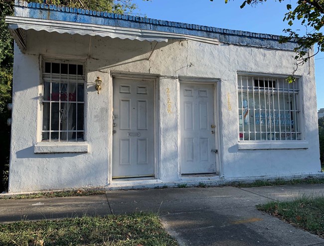 Holman's Barber Shop, North Carolina, small single-story white-painted building