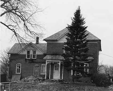 80001976 Hebeisen House Image of brick house, lawn, trees, and sky.