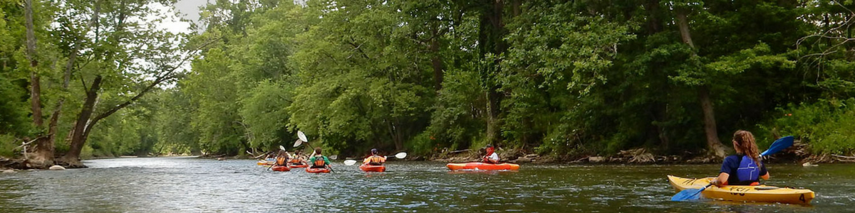 People kayak the Cuyahoga River.