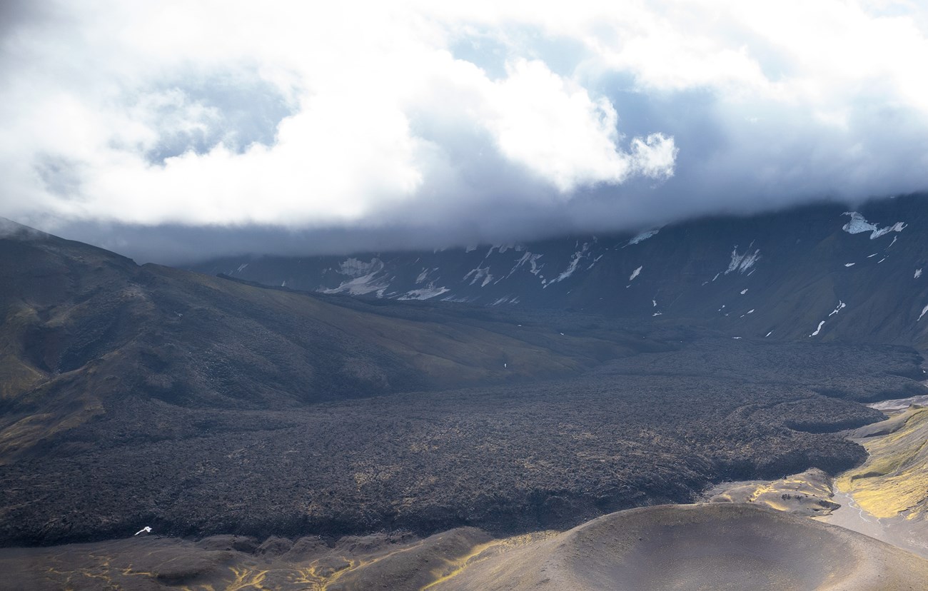 photo of a valley floor covered by lava