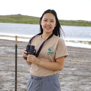 Intern holding binoculars