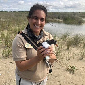 Intern holding bird