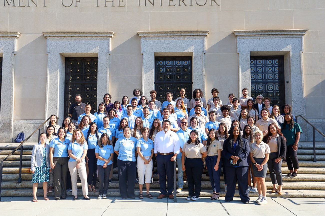 Intern with National Park Service leadership in front of the Department of the Interior Building