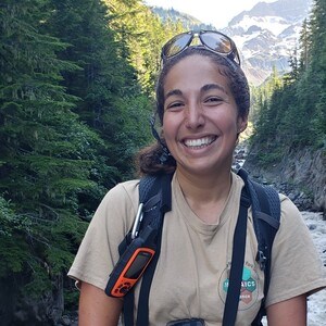 Intern smiling by river