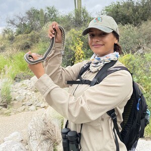 Intern holding snake