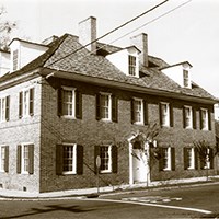 three-story house with dormer windows