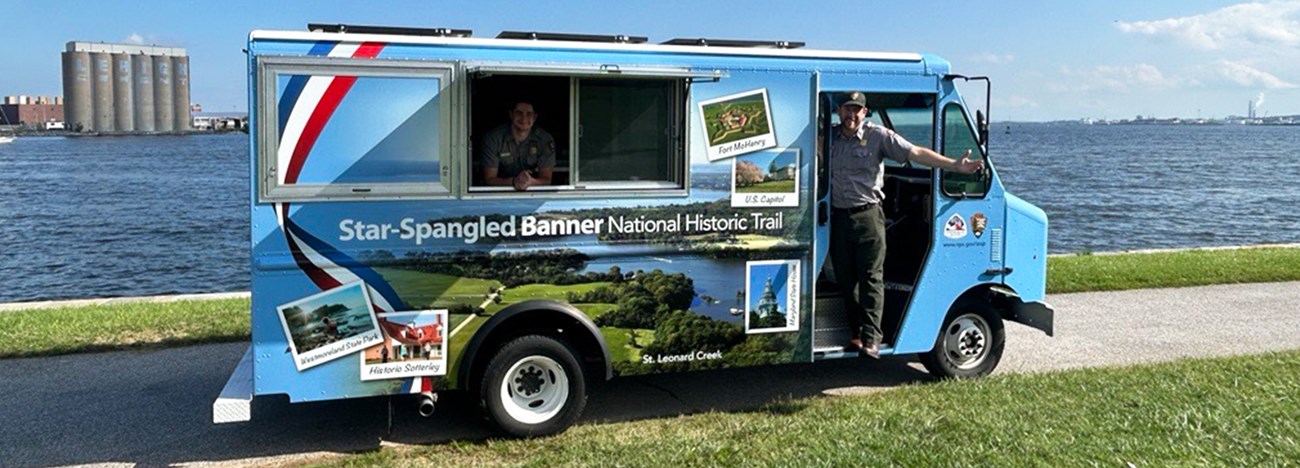 Picture of a van wrapped in beautiful pictures showcasing all of the places around the Chesapeake Bay you can go along the Star-Spangled Trail