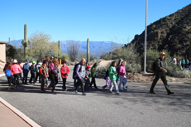 Ranger leading field trip at Visitor Center.