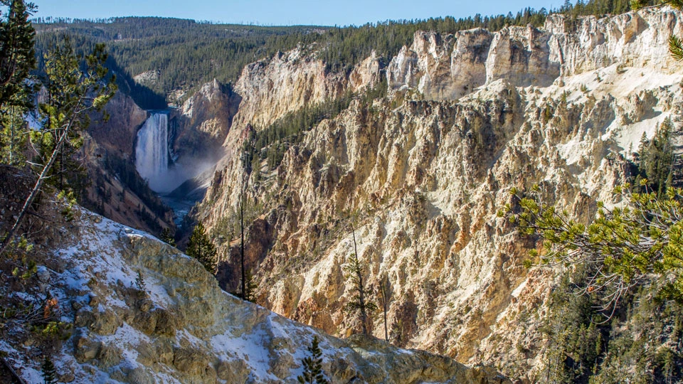 Lower Falls of the Yellowstone River Lower Falls plunges down into a yellow canyon.