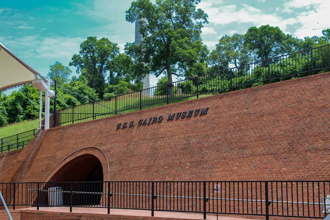 A brick building with the words USS Cairo on it