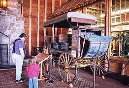 (YELL 90058-3) Studebaker mountain stage used by the Shaw and Powell Camping Company on exhibit at the Old Faithful Lodge.