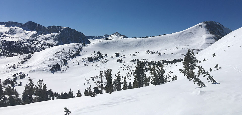 Snow covered Fletcher, Vogelsang, and Rafferty Peaks left to right on February 28, 2022.