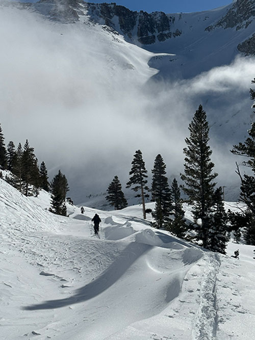 Frozen ocean waves with skiers, Ellery Lake, January 19, 2023.