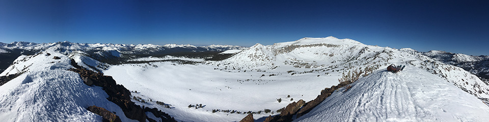 Gaylor Lakes Basin, April 3, 2021. Snow covered lake and mountains.