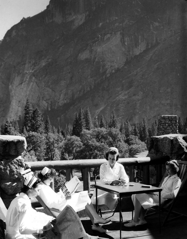 Nurses for the wartime hospital relax on a porch