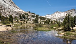 An alpine lake and granite peaks on the trail from Vogelsang to Cathedral