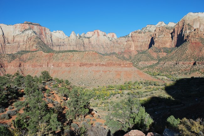 A view of the Towers of the Virgin, tall sandstone cliffs, from the Watchman Trail Overlook
